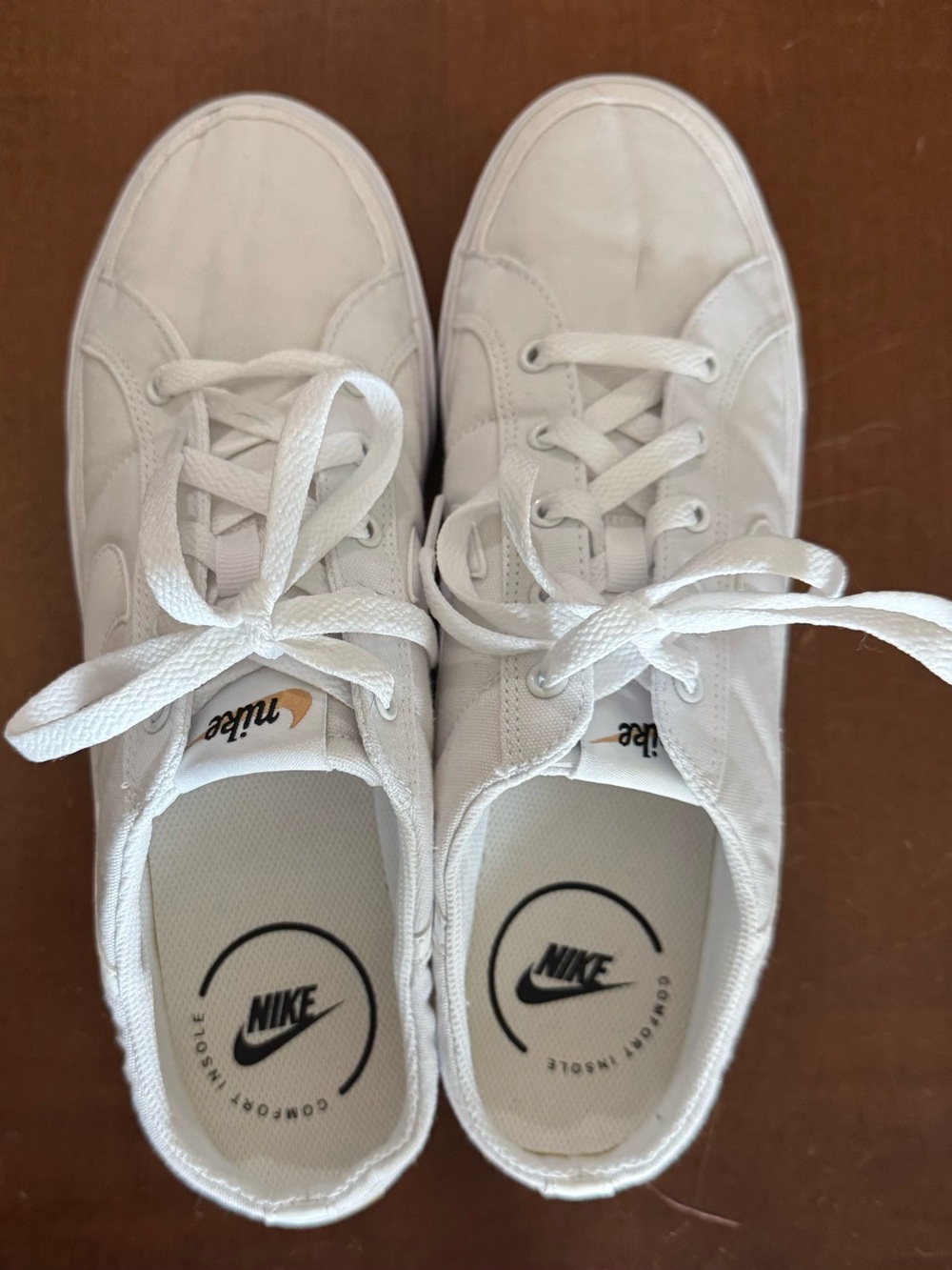 Nike White Low-Top Canvas Sneakers with Subtle Black Logos